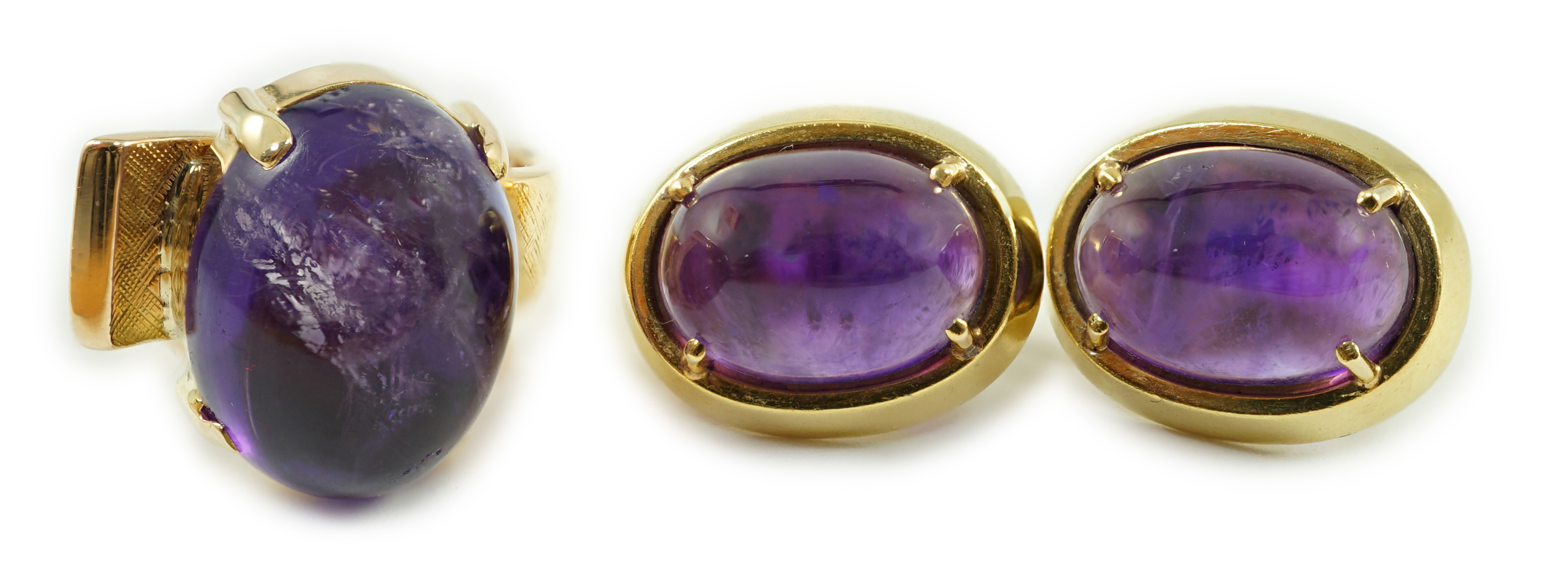 A modern gold and cabochon oval amethyst set dress ring and a pair of similar earrings